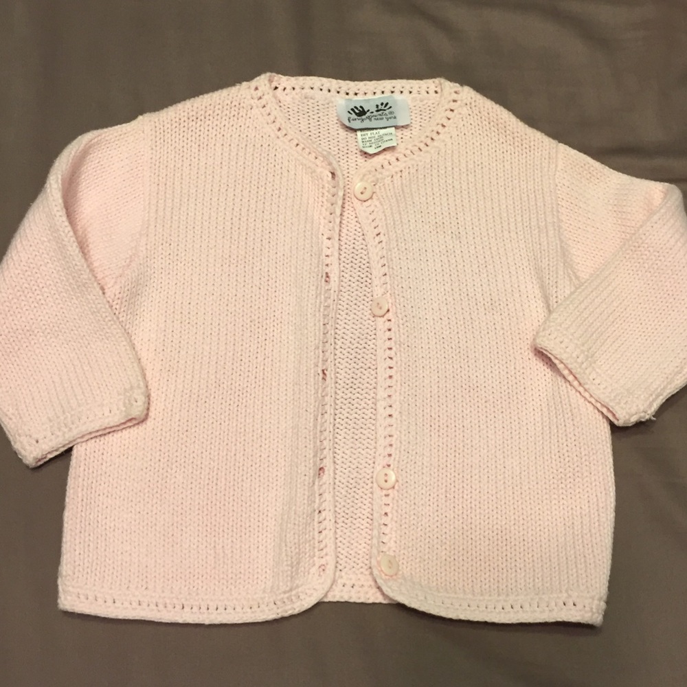 Soft blush colored baby girls sweater